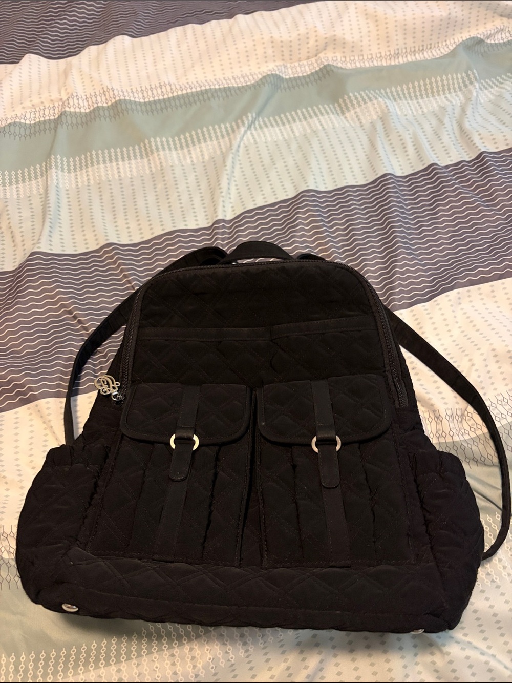 Vera Bradley Black Quilted Backpack with Front Buckle Pockets.